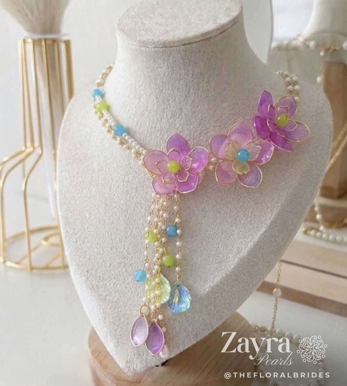 Zayra Pearls Candy Blossom 6-piece premium floral bridal jewellery set featuring pastel pink, blue, and lime resin flower petals with delicate pearl strings on a display. Bride wearing premium handcrafted bridal wedding jewellery from Zayra Pearls