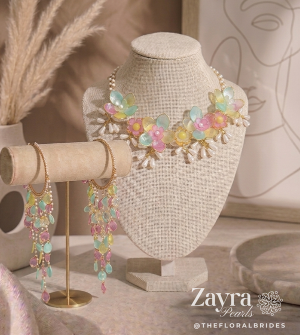 Zayra Pearls Pastel Bloom premium bridal jewellery set featuring translucent mint, pink, and yellow resin flower petals with delicate pearl strings, displayed haldi mehendi bridal jewellery