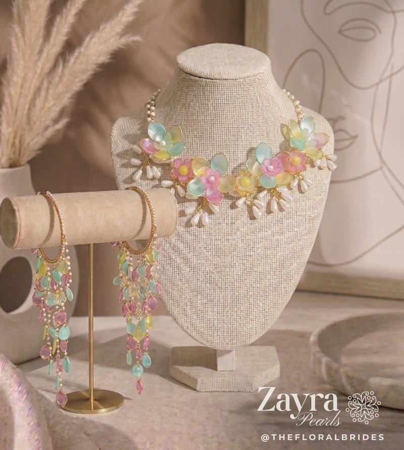 Zayra Pearls Pastel Bloom premium bridal jewellery set featuring translucent mint, pink, and yellow resin flower petals with delicate pearl strings, displayed haldi mehendi bridal jewellery