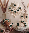 Handcrafted green and white Cowrie Sea Shell Mehndi jewelry set with necklace, maang tikka, earrings, and hand harness on display as shown by zayra pearls