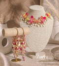 Zayra Pearls Sunset Flora 10-piece luxury floral bridal jewellery set featuring fuchsia, orange, and yellow resin blossom petals with hanging pearls and kaleere bangles on display.