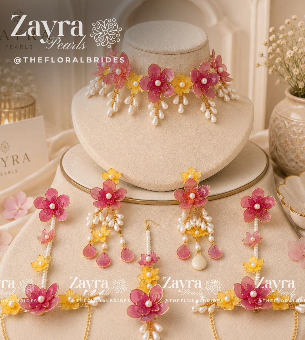 Handcrafted 3-color Aura Bloom Haldi Jewellery Set with pastel red  necklace earrings hathphool and maangtikka by Zayra Pearls.