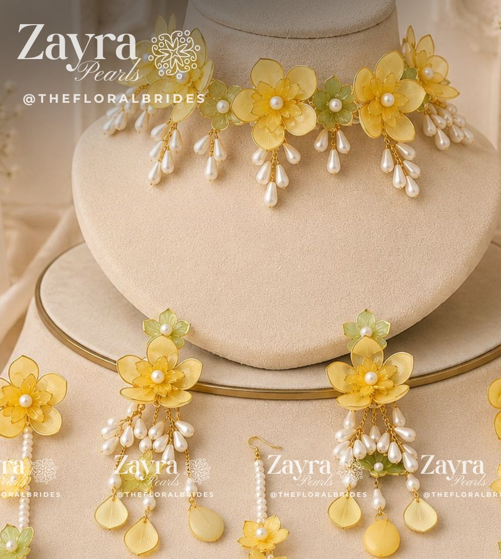 Handcrafted 3-color Aura Bloom Haldi Jewellery Set with pastel yellow necklace earrings hathphool and maangtikka by Zayra Pearls