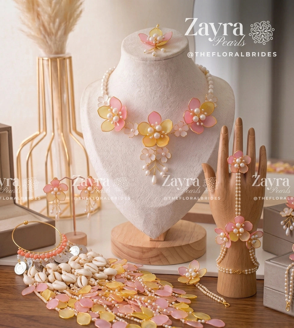 Handcrafted pink and yellow floral Blush Aura haldi mehendi bridal set with necklace earrings hathphool maangtikka and kaleere by Zayra Pearls.