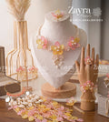Handcrafted pink and yellow floral Blush Aura haldi mehendi bridal set with necklace earrings hathphool maangtikka and kaleere by Zayra Pearls.