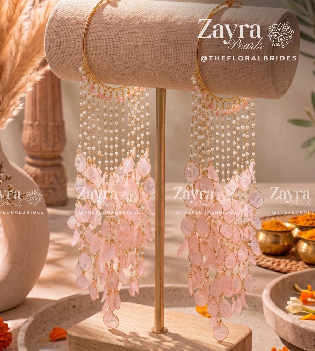 Handcrafted blush bloom haldi carnival kaleere with pink resin petals and pearl tassels by Zayra Pearls.