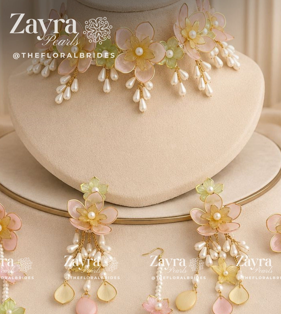 Handcrafted 3-color Aura Bloom Haldi Jewellery Set with pastel pink red and yellow necklace earrings hathphool and maangtikka by Zayra Pearls.