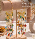 Handcrafted royal carnival haldi carnival jewelry kaleere with embossed gold coins and cowrie shells by Zayra Pearls.