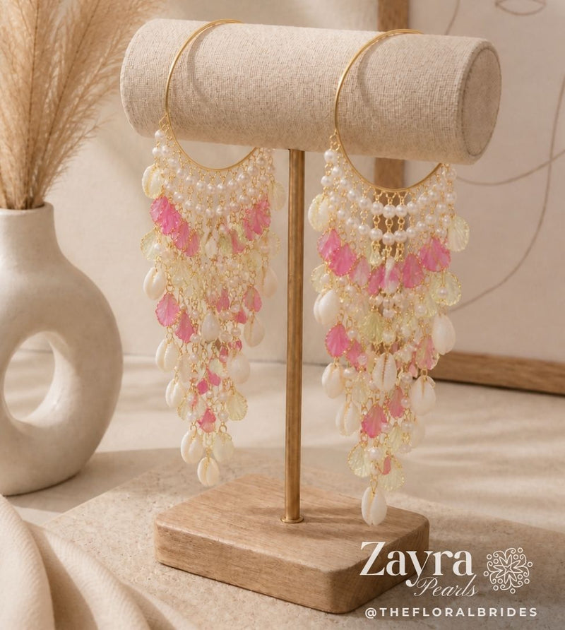 Delicate pink and white pearl Haldi Bangles for Bride (Pair) on a wooden stand with 'Zayra Pearls' branding.