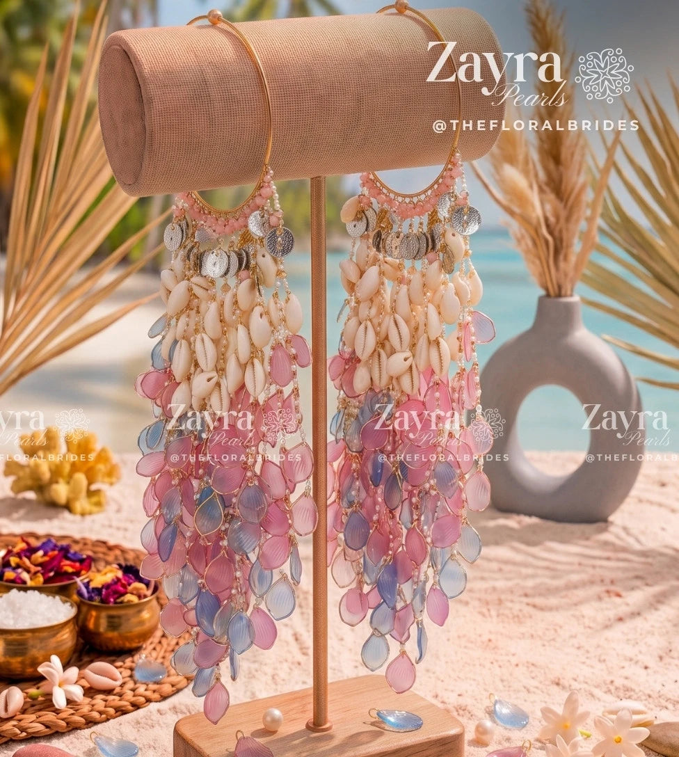 Close-up of cascading cowrie shell and pastel pink and blue resin petal kaleere from the Sky Blush bridal set for haldi pastel look collection.