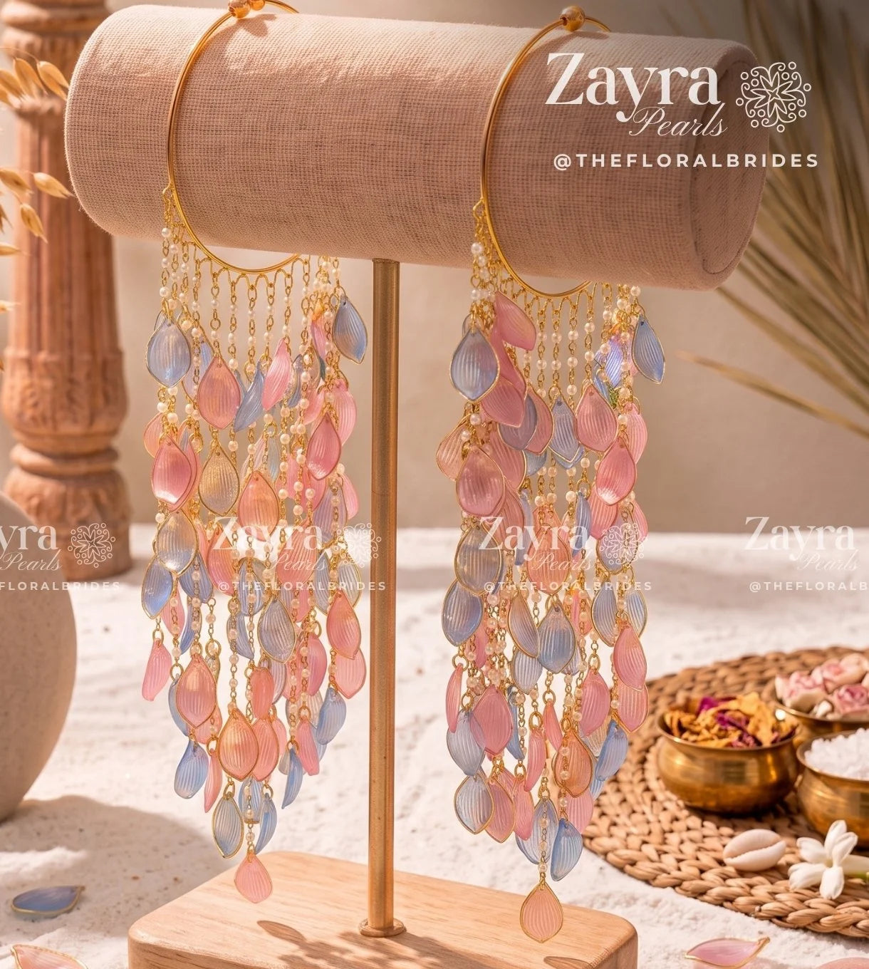 Handcrafted softy carnival jewelry bangels featuring pastel pink and blue resin flower petals and pearls by Zayra Pearls.
