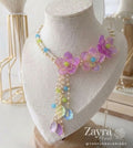 Zayra Pearls Candy Blossom 6-piece premium floral bridal jewellery set featuring pastel pink, blue, and lime resin flower petals with delicate pearl strings on a display.