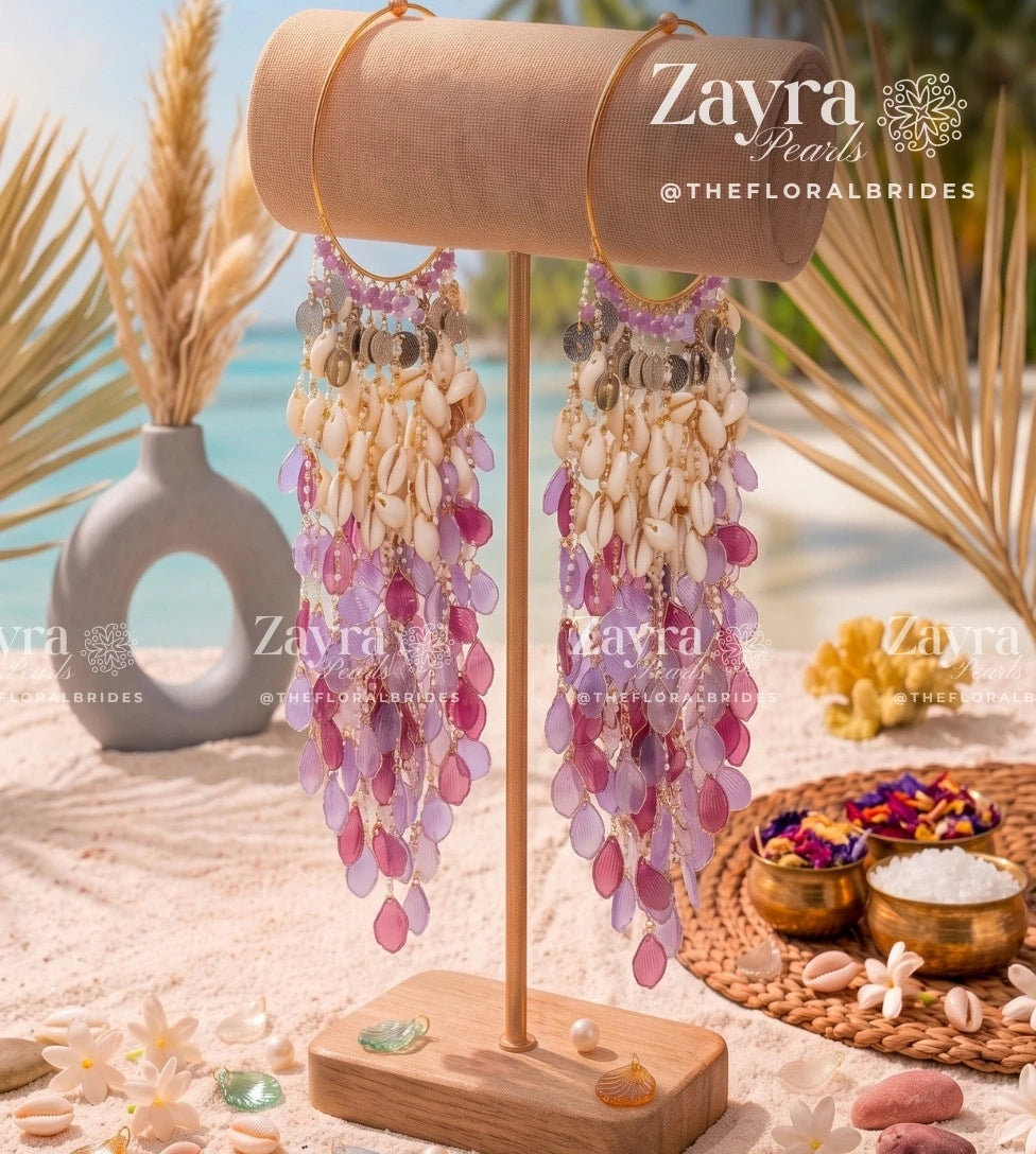 Close-up of cascading cowrie shell and resin petal kaleere from the viral haldi jewelry collection.